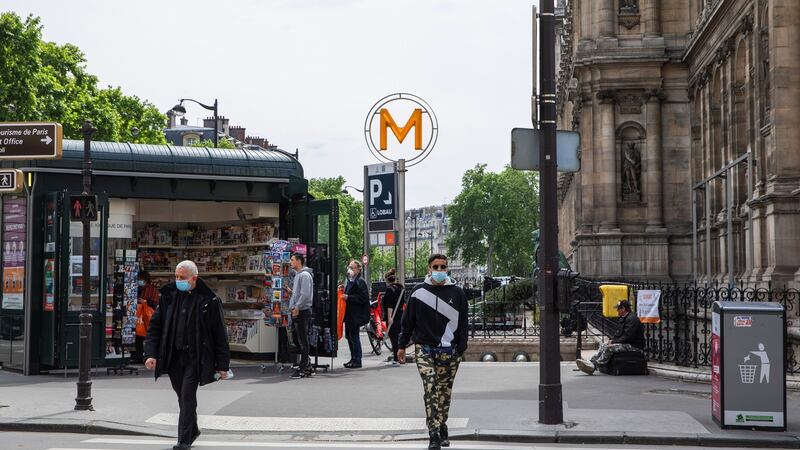 Pedestrians near the Métro station on Rue de Rivoli in Paris on Monday as France begins easing lockdown. Photograph: Adrienne Surprenant/Bloomberg