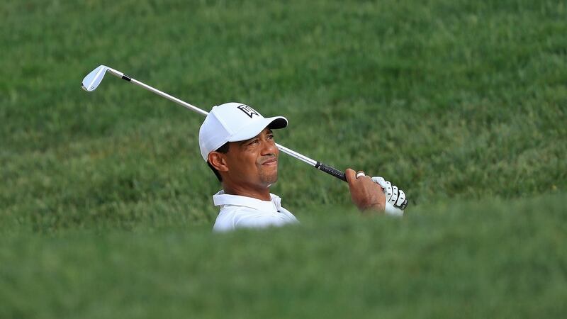 Woods hits his third shot on the 13th hole. Photo: Sam Greenwood/Getty Images
