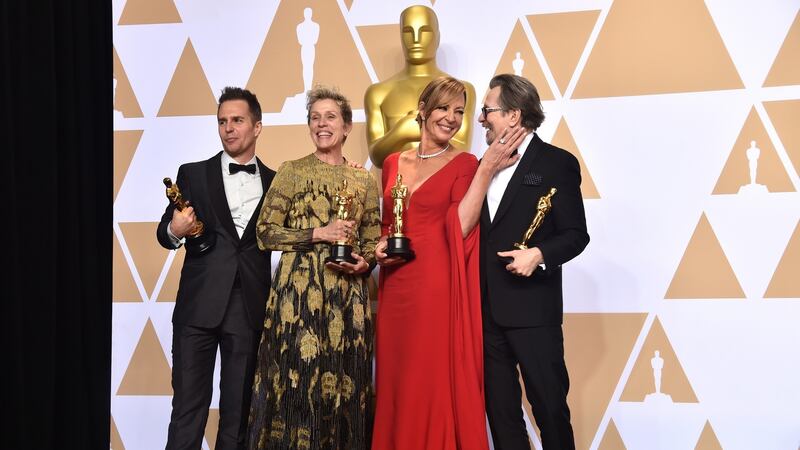 Actor Sam Rockwell, winner of the Best Supporting Actor award for ‘Three Billboards Outside Ebbing, Missouri;’ actor Frances McDormand, winner of the Best Actress Award for ‘Three Billboards Outside Ebbing, Missouri;’ actor Allison Janney, winner of the Best Supporting Actress award for ‘I, Tonya;’ and actor Gary Oldman, winner of the Best Actor award for ‘Darkest Hour,’ poses in the press room during the 90th Annual Academy Awards at Hollywood & Highland Center on March 4, 2018 in Hollywood, California. Photo by Alberto E. Rodriguez/Getty Images