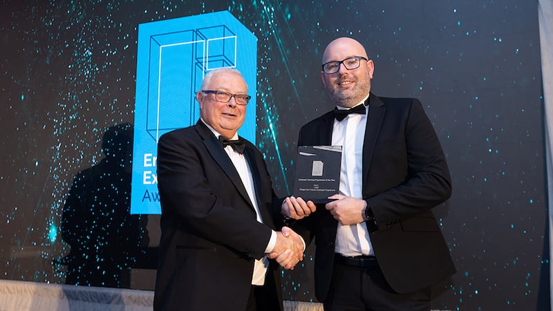 James McNamara, awards judge, presents the graduate training programme of the year award to Darren Holmes, ORS