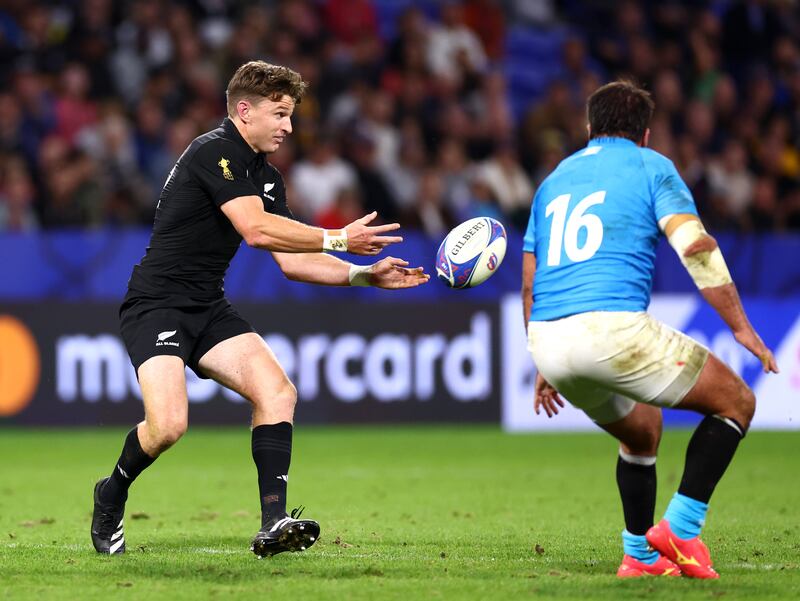 Beauden Barrett of New Zealand passes the ball whilst under pressure from Felipe Berchesi of Uruguay. Photograph: Chris Hyde/Getty