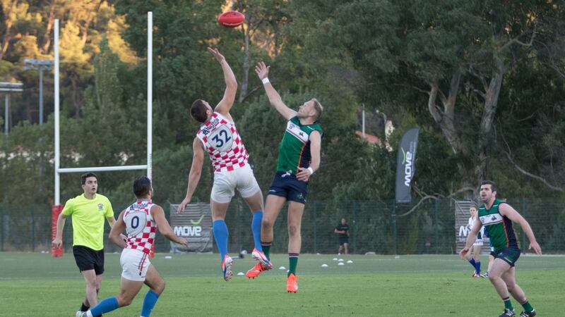 Gavin Murray of South Dublin Swans and  Ireland, battles in the ruck against Josip Habljak of Croatia, in the final of the Euro 2016 AFL Championship in Lisbon