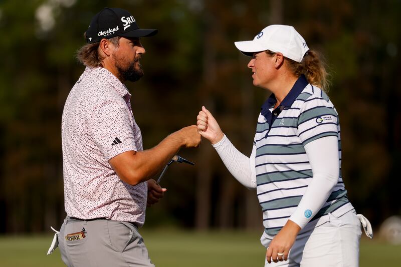 Andrew Novak and Lauren Coughlin of the United States react to a putt. Photograph: Johnnie Izquierdo/Getty