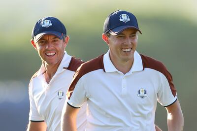 Matt Fitzpatrick shares a laugh with Rory McIlroy during a fourball match in Rome. Photograph:  Andrew Redington/Getty Images