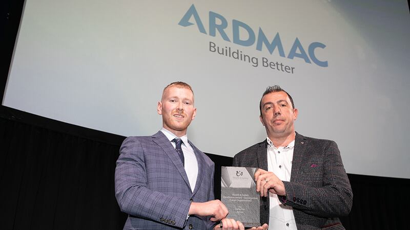 Neil Wall, Head of Entries at BusinessRiver, presents the Health & Safety Excellence Award - Construction (Large Organisation) award to Pearse McCartan, Ardmac.