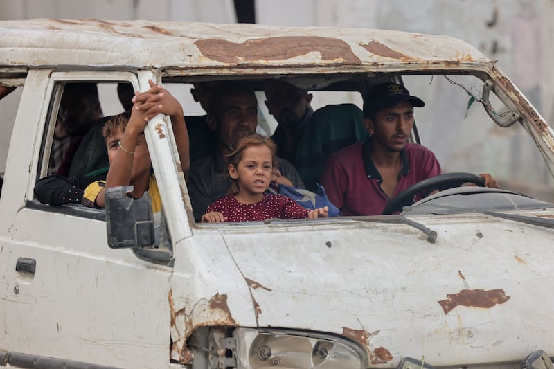 A family returns by car to the Al-Katiba area of Khan Yunis, southern Gaza. Photograph:  Abdelrahman Rashad / Middle East Images via AFP