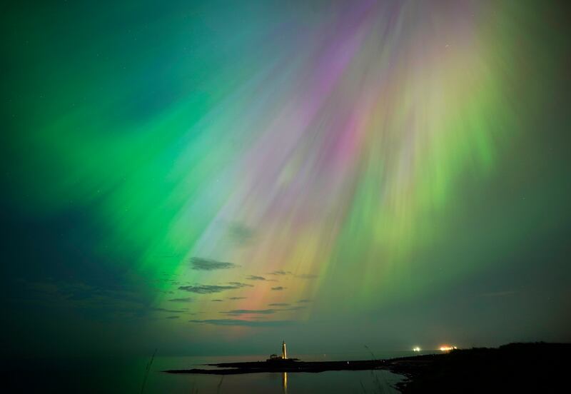 The Northern Lights over St Mary's Lighthouse in Whitley Bay in the UK. Photograph: Owen Humphreys/PA Wire