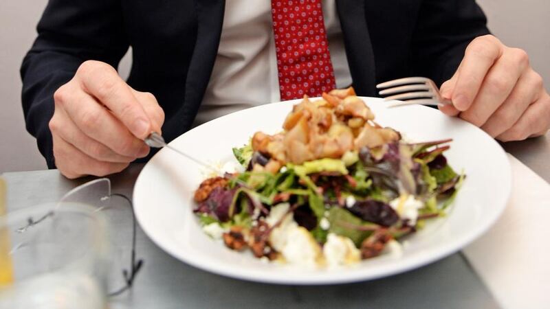 Simon Coveney takes our reporter’s lunch at the request of the photographer, who thinks the salad is more photogenic than what the Minister has ordered. Photograph: Eric Luke
