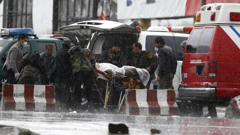 A man who was injured after the Taliban  attack on the ministry of defence in Kabul  is brought to hospital. Photograph: Jawad Jalali/EPA