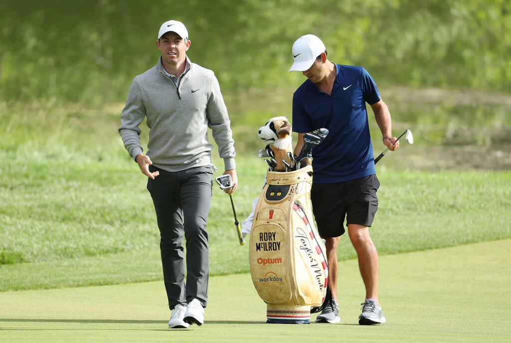 Rory McIlroy exchanges clubs with caddie Harry Diamond as he prepares to putt on the ninth green during a practice round prior to the US Open at The Country Club in Brookline, Massachusetts. Photograph: Warren Little/Getty Images