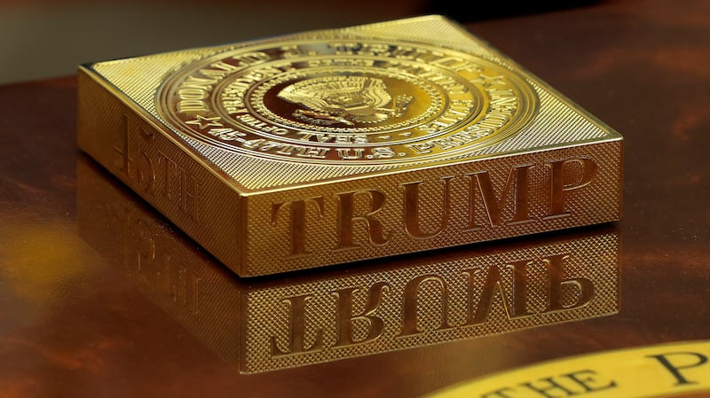 A gold drink coaster box sits on Donald Trump's coffee table. Photograph: Chip Somodevilla/Getty Images
