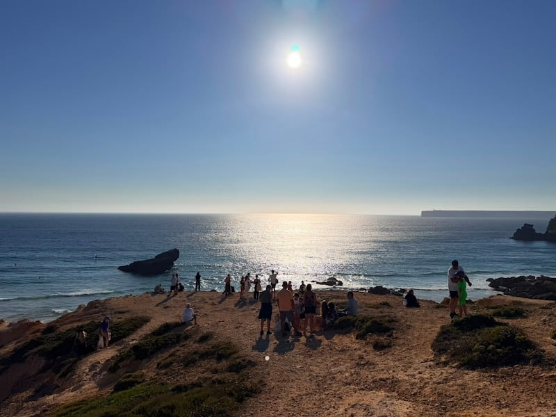 People watching the eclipse at the cliffs in Sagres. Photograph: Conor Pope