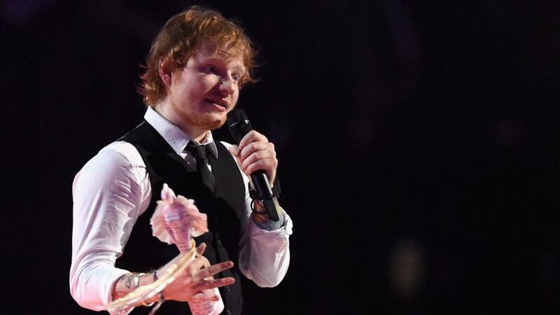 Ed Sheeran wth his Album of the Year award on stage during the Brit Awards 2015. Photograph: Gareth Cattermole/Getty Images