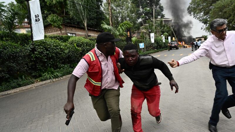 An injured man is evacuated from the scene of the  explosion at a hotel complex in Nairobi’s Westlands suburb, on Tuesday. Photograph:  Simon Maina/AFP/Getty Images