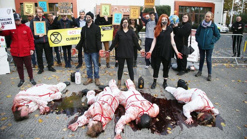 Extinction Rebellion Climate Activists Fabian Mac Ginty O Neill, Leontien Friel Darrell, Jamie O’Neill and Sarah Doherty staged  non-violent, direct action outside the Burlington Clayton Hotel in Dublin. Photograph: Stephen Collins/Collins Photos