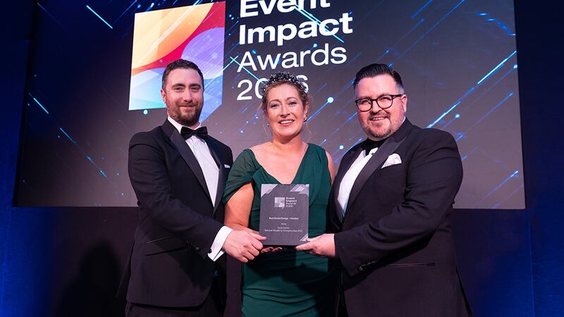 Gayle Tarmey, awards judge, presents the best event design - festival award to Clyde Carroll and Ben Rowe, Davis Events