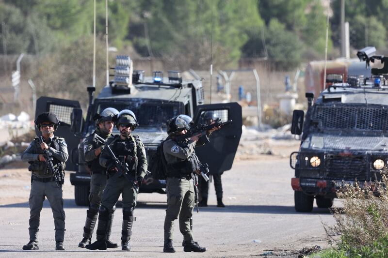 Israeli border guards take position outside the Ofer military camp between Ramallah and Baytunia in the occupied West Bank city amid preparations for the release of Palestinian prisoners in exchange for Israeli hostages held by Hamas in Gaza. Photograph: JAAFAR ASHTIYEH/AFP via Getty Images