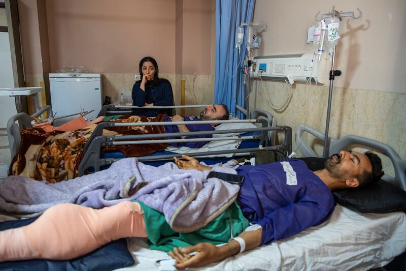 People wounded by airstrikes on a highway bridge near Tehran, Iran, on Friday On Thursday, the US struck the highway bridge near the capital, and Iranian news outlets reported eight people were killed. Photograph: Arash Khamooshi/The New York Times
                      