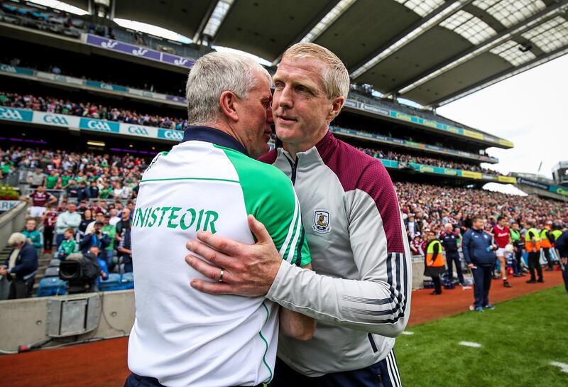 Managers John Kiely with Henry Shefflin at the final whistle. Photograph: Evan Treacy/Inpho