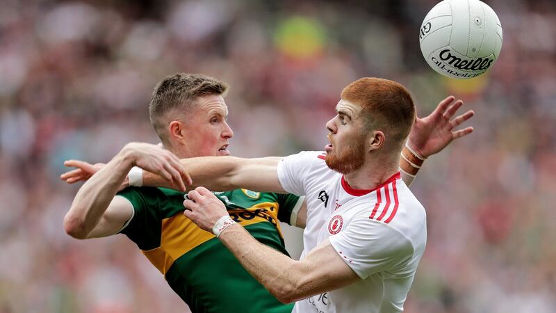 Kerry’s Jason Foley battles for the ball with Cathal McShane of Tyrone. Photograph: Laszlo Geczo/Inpho