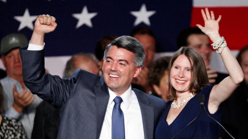 Republican Cory Gardner waves with his wife Jamie after winning the midterm elections in Denver, Colorado, November 4, 2014. REUTERS/Rick Wilking