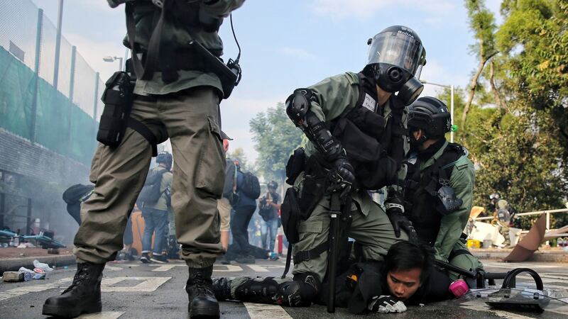 Riot police detained a student during clashes at the Chinese University in Hong Kong. Photograph: Steve Leung/HK01 via AP