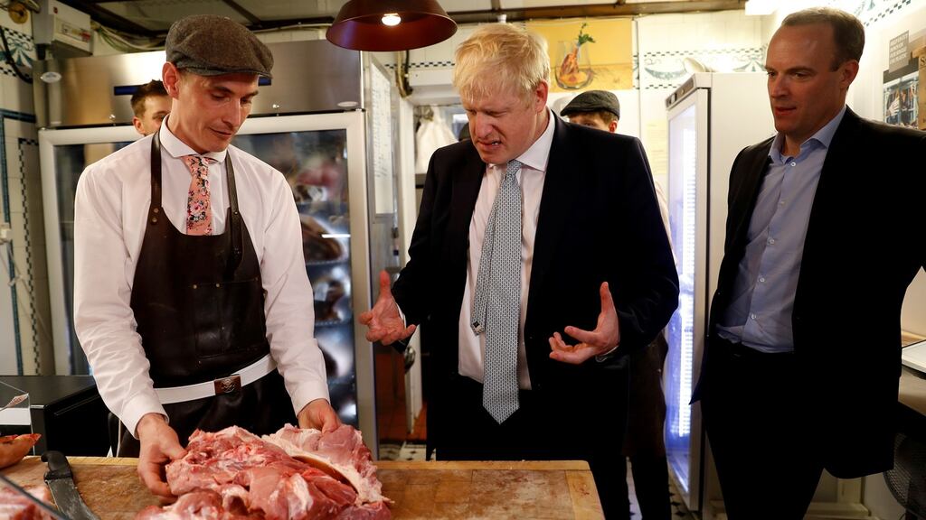 Boris Johnson and Dominic Raab visiting a butcher’s shop in Oxshott, Surrey. Photograph: Peter Nicholls/Reuters