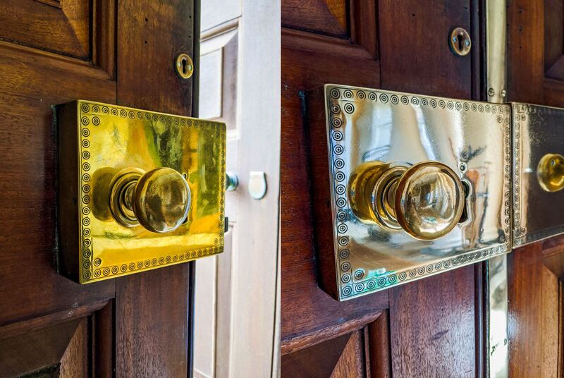 Before (left) and after image showing the polished door lock on the main door of Castle Ward. Photograph: Kris Reid/PA Wire