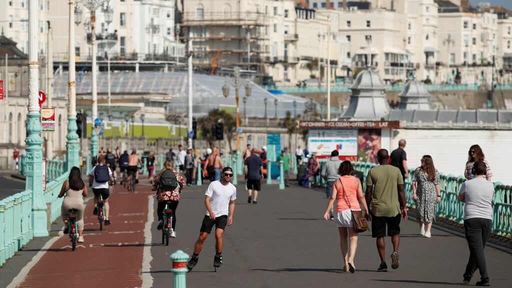 People on Brighton pier in southeast England on Friday, as the spread of Covid-19 continues. Photograph: Andrew Couldridge/Reuters