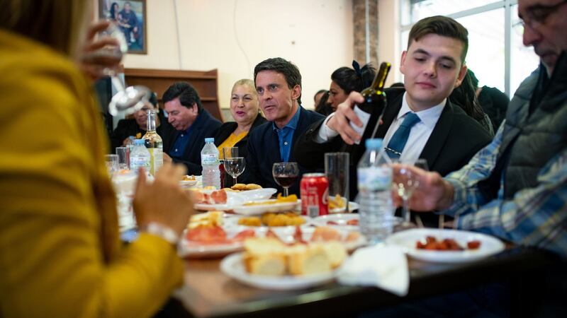 Former French prime minister and mayoral candidate for Barcelona Manuel Valls  (centre) meets members of the local gypsy community. Photograph: Josep Lago