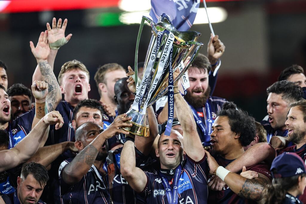 The Bordeaux-Begles team lift the Investec Champions Cup after beating Northampton Saints at the Principality Stadium in Cardiff. Photograph: Billy Stickland/©INPHO