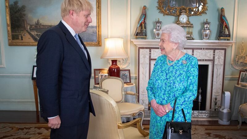 Britain’s Queen Elizabeth II welcomes newly elected leader of the Conservative party Boris Johnson at Buckingham Palace, where she invited him to become prime minister and form a  government. Photograph: Victoria Jones/EPA