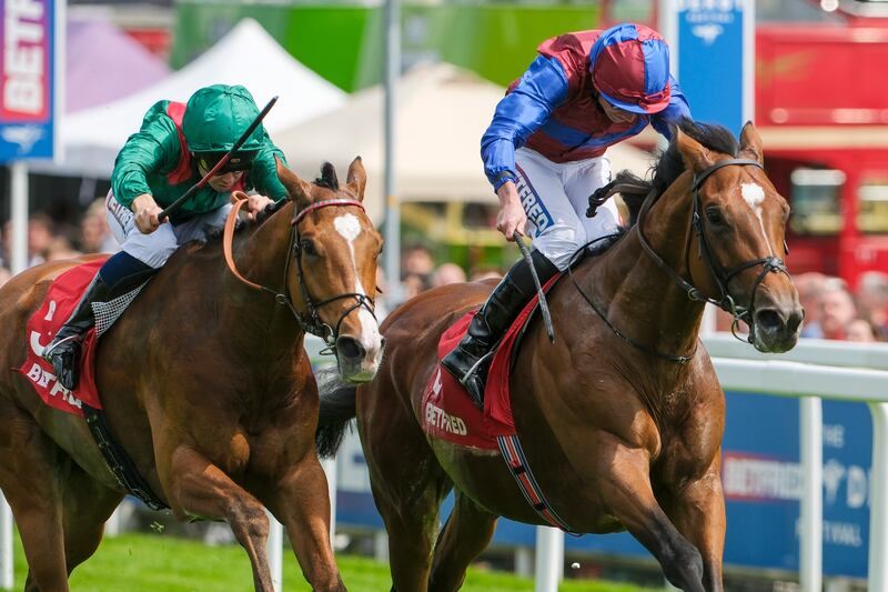 Ryan Moore rides Jan Brueghel (R) to victory in the Betfred Coronation Cup during Ladies Day at Epsom Downs Racecourse in Epsom, England. Photograph: Alan Crowhurst/Getty Images