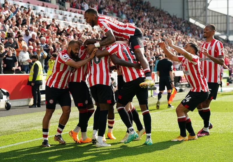 Brentford players celebrate after scoring in injury time against Nottingham Forest. Photograph: Nick Potts/PA
