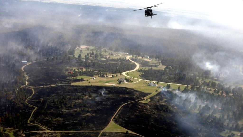 A US Army Blackhawk helicopter patrols over the Black Forest Fire in Black Forest, Colorado yesterday. Photograph: Rick Wilking/Reuters