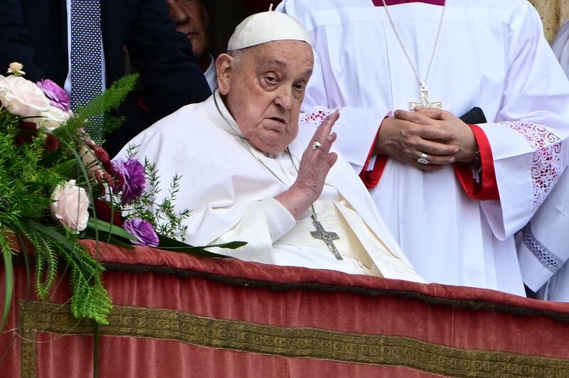 Pope Francis waves to the crowd from the main balcony of St Peter's Basilica during his Urbi et Orbi message on Sunday. Photograph:  Tiziana Fabi/AFP via Getty Images          