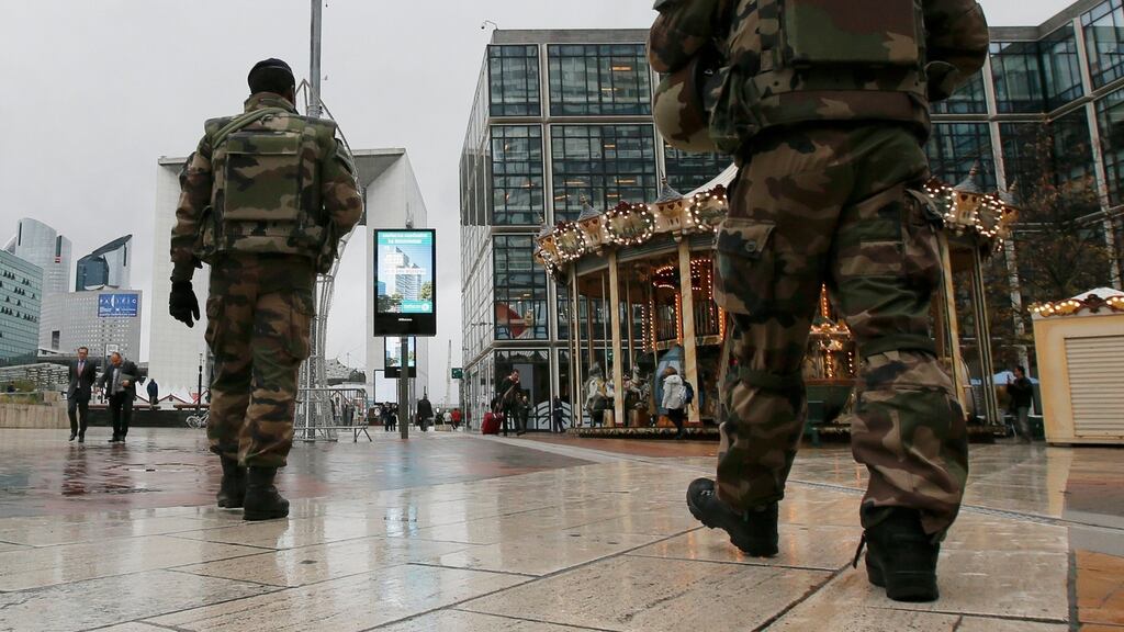 Soldiers patrol near the Arche de la Defense at La Defense business district in Nanterre near Paris, France, November 19th, 2015. Photograph: Gonzalo Fuentes/Reuters