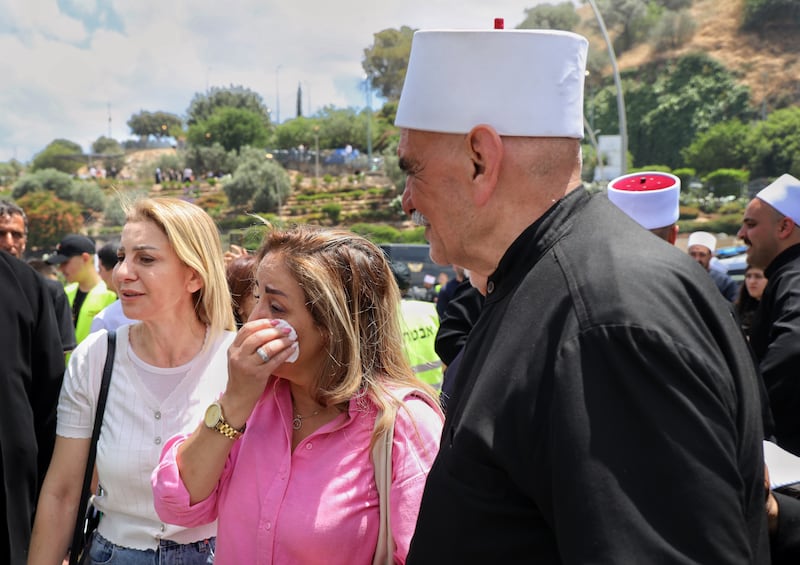 Hanan al-Deen cried as she bid farewell to her family and old neighbours from her hometown of Achrafieh in Syria’s Darayya province. Photograph: Hannah McCarthy