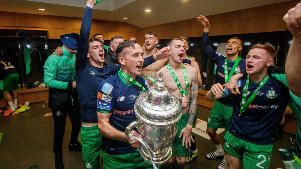 Shamrock Rovers celebrate with the trophy in the dressing room after winning the FAI Cup last year. Photo: Ryan Byrne/Inpho