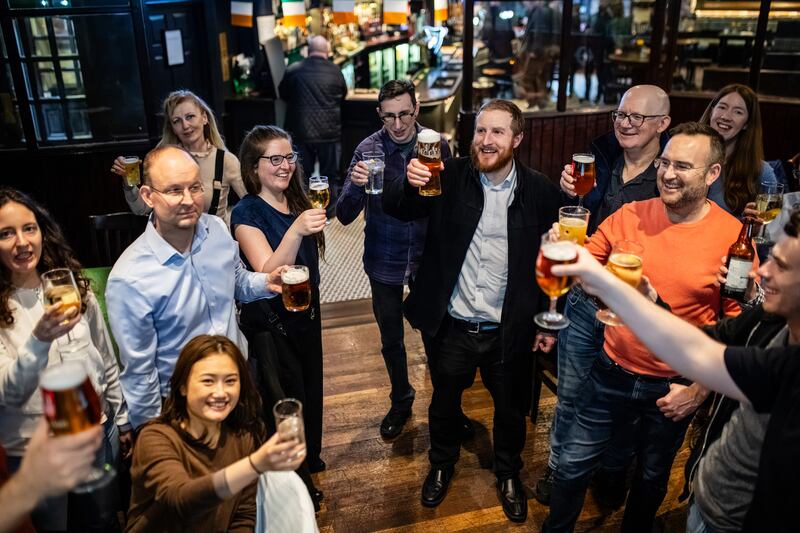 The Metropolitan Walkers toast with a drink at the end of their walk. Photograph: Jess Cheetham/The New York Times