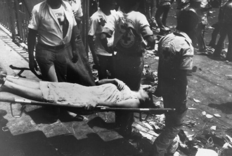 A woman is carried away on a stretcher after rioting and killing at Romero’s funeral on  March 30th, 1980 which was attended by more than 250,000 people. Estimates of how many died range from 30 to 50. Photograph: Keystone/Getty