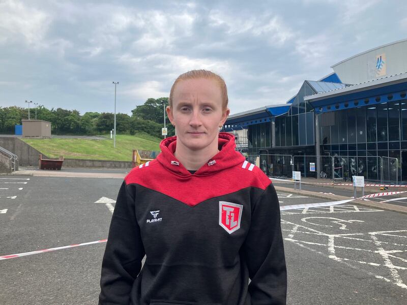 Larne leisure centre swim coach, Olympian Danielle Hill, became emotional as she recalled the moment she saw four masked men appear when she went to move her car outside the centre on Wednesday evening. Photograph: Seanín Graham