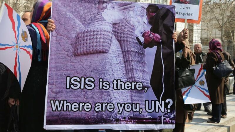 A protester in front of the United Nations (UN) office in Tehran  to demonstrate against  attacks on Assyrians in Iraq and Syria by the Islamic State group. Photograph: Atta Kenare/AFP/Getty Images.