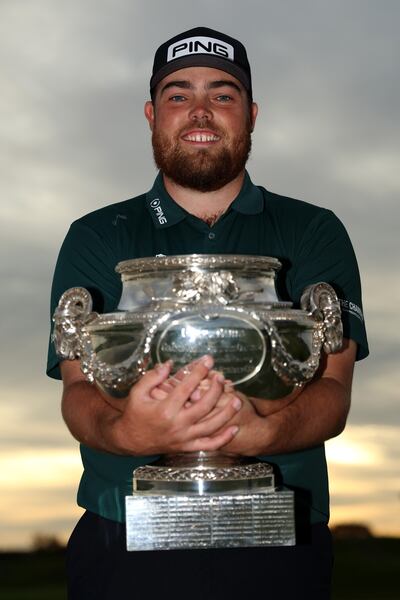 Dan Bradbury poses with the trophy after winning the FedEx Open de France 2024 at Le Golf National on Sunday. Photograph: Luke Walker/Getty Images