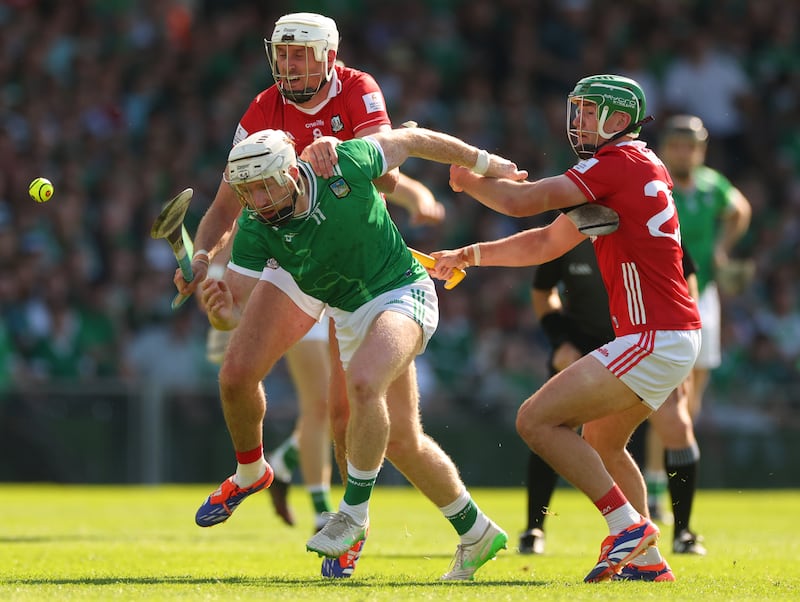 Cork’s Tim O'Mahony and Brian Roche close in on Limerick's Cian Lynch in the Munster hurling championship. Photograph: James Crombie/Inpho