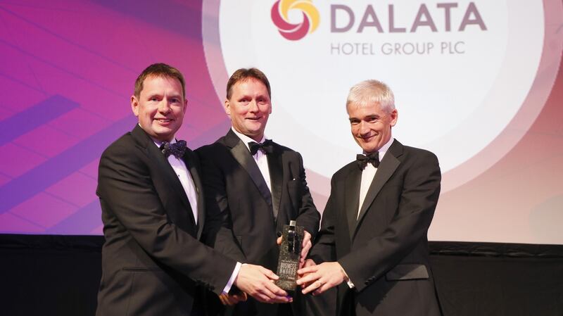 Seamus Hand, managing partner of KPMG, presents the Company of the Year award to Dermot Crowley and Stephen McNally, deputy chief executives at Dalata at The Irish Times Business Awards held at the Mansion House. Photograph: Kieran Harnett