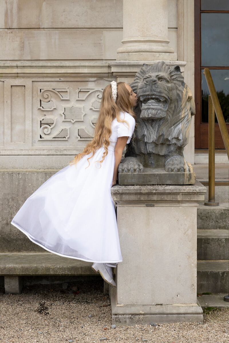 Sophia:   Dress, €330, Celebrations; hairband, €84, Alice+Blair; white satin shoes, €45, Rainbow Club