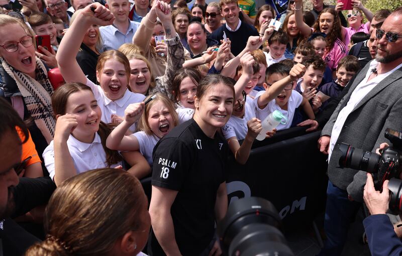 Students from Holy Cross School with Katie Taylor during the public workout in Dundrum. Photograph: Dara Mac Dónaill