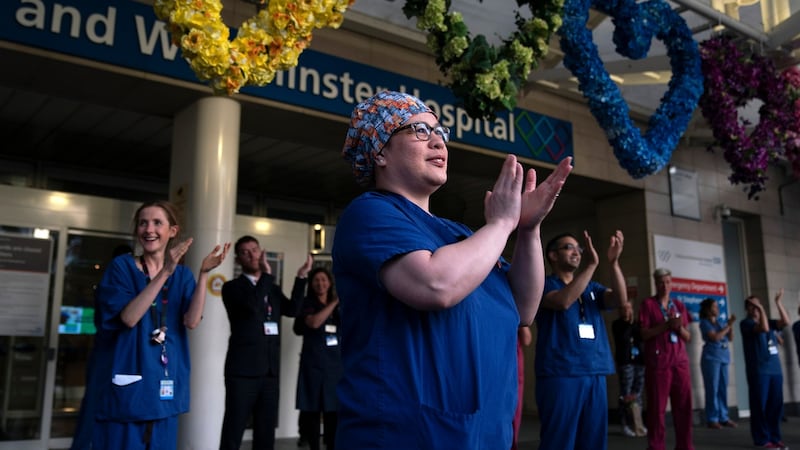 NHS staff applaud during the ‘Clap For Our Carers’ campaign outside the Chelsea and Westminster hospital in London. Photograph: Will Oliver/EPA