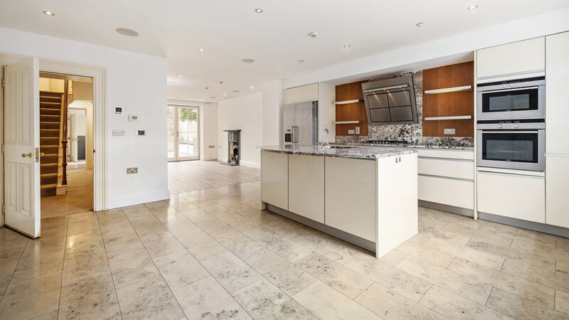 Kitchen opening into family room at basement level